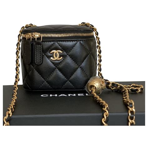 chanel small black|Chanel small purse with chain.